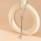 CAMILA - Collar estilo corbatín de malla serpiente con nudo corredizo y borlas en baño de rodio y plata de ley™