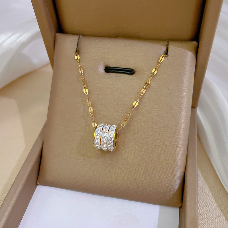 ETERNITY - Collar con colgante cilíndrico de aros en pavé de circonias y baño de oro™