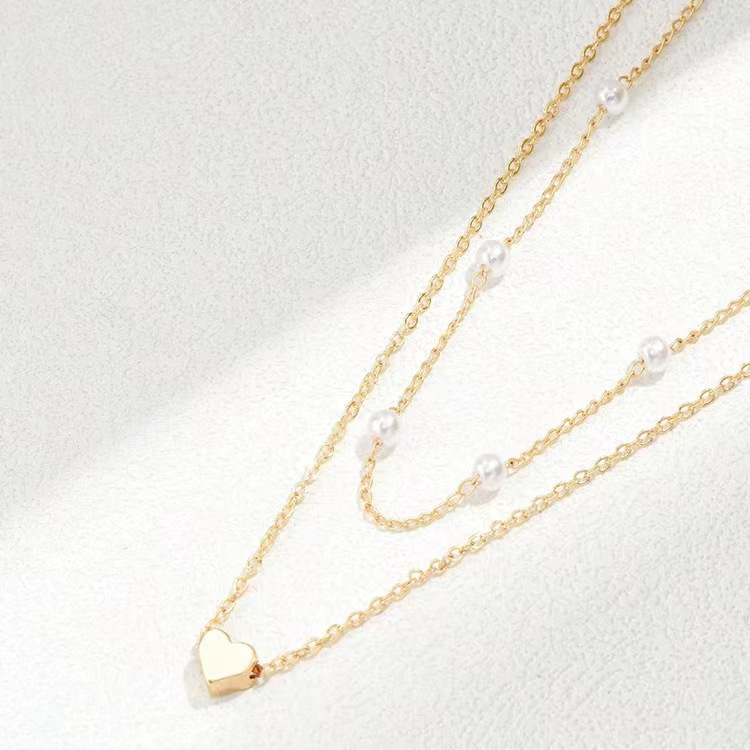 ARIEL - Collar doble de cadenas finas con perlas y dije de corazón en baño de oro™