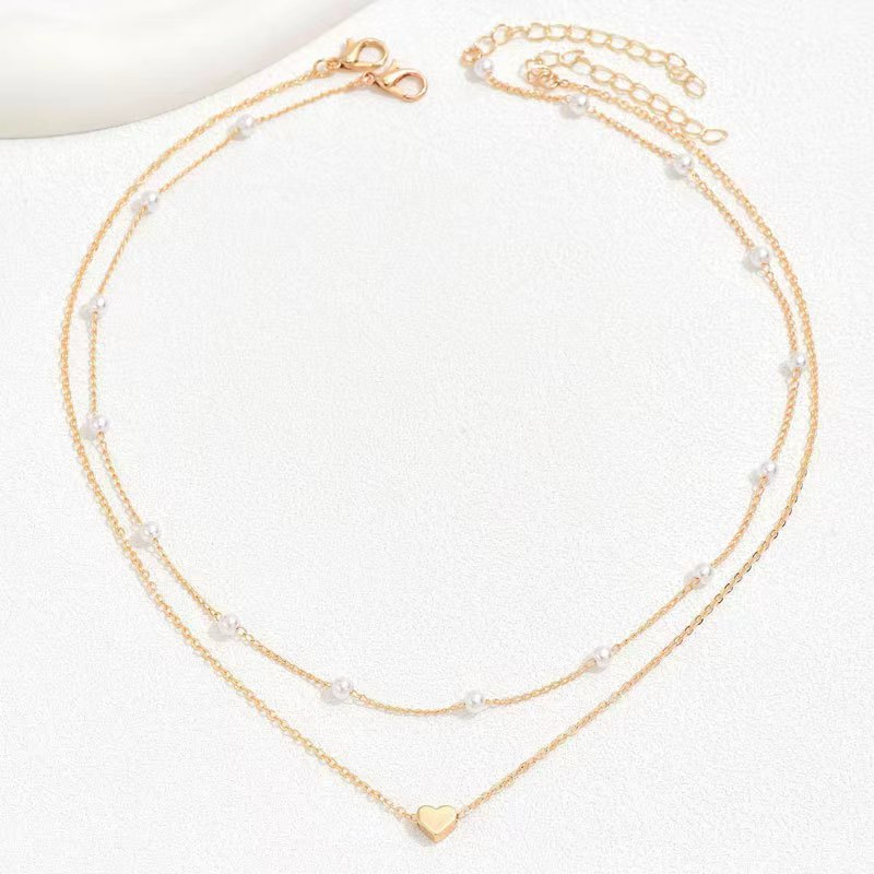 ARIEL - Collar doble de cadenas finas con perlas y dije de corazón en baño de oro™