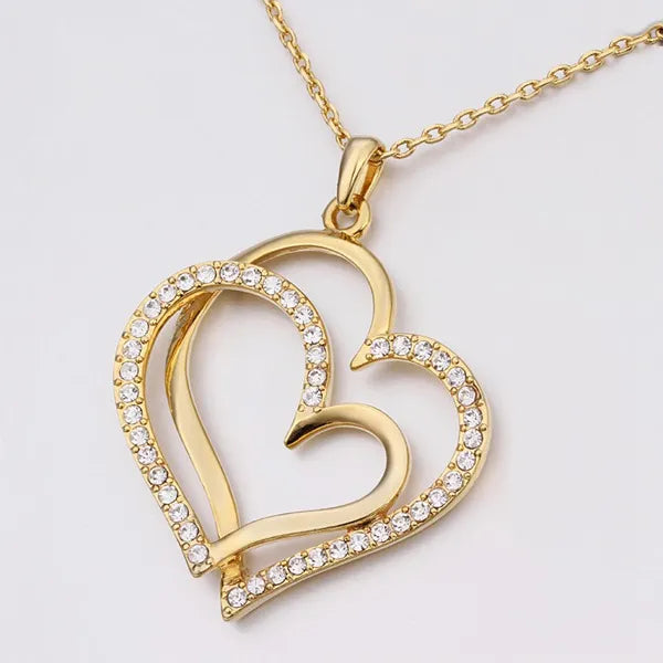 AMORA - Collar con colgante de corazón calado en pavé de circonias y baño de oro™