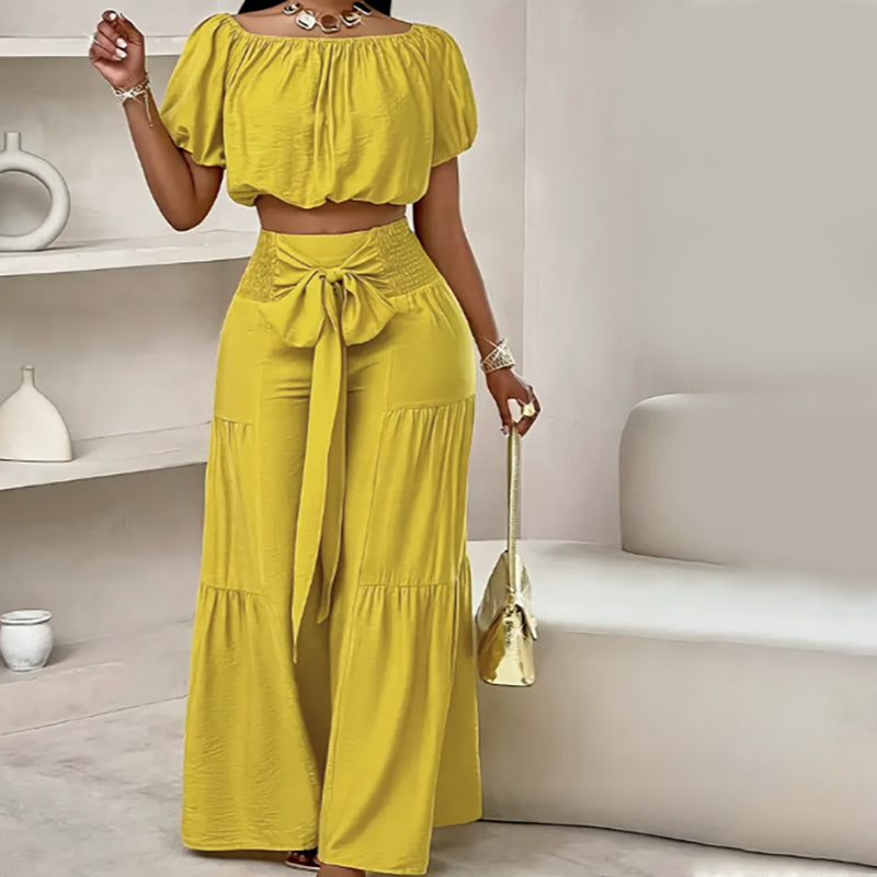 👚 49 % DE RÉDUCTION EN CE MOMENT ! 🌸 Ensemble 2 pièces composé d'un haut à manches bouffantes et épaules dénudées et d'un pantalon à jambes larges – Élégant, confortable et idéal pour les journées d'été ☀️