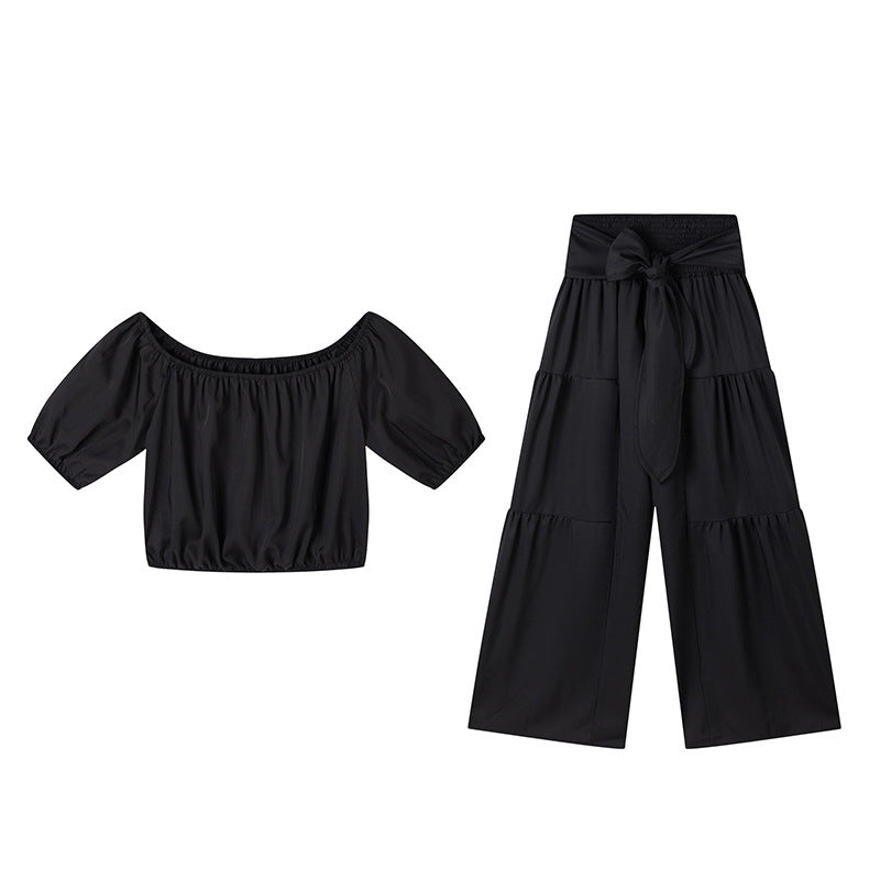 👚 49 % DE RÉDUCTION EN CE MOMENT ! 🌸 Ensemble 2 pièces composé d'un haut à manches bouffantes et épaules dénudées et d'un pantalon à jambes larges – Élégant, confortable et idéal pour les journées d'été ☀️