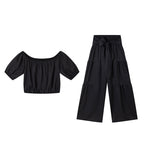 👚 49 % DE RÉDUCTION EN CE MOMENT ! 🌸 Ensemble 2 pièces composé d'un haut à manches bouffantes et épaules dénudées et d'un pantalon à jambes larges – Élégant, confortable et idéal pour les journées d'été ☀️