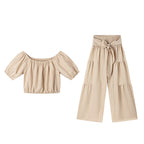 👚 49 % DE RÉDUCTION EN CE MOMENT ! 🌸 Ensemble 2 pièces composé d'un haut à manches bouffantes et épaules dénudées et d'un pantalon à jambes larges – Élégant, confortable et idéal pour les journées d'été ☀️