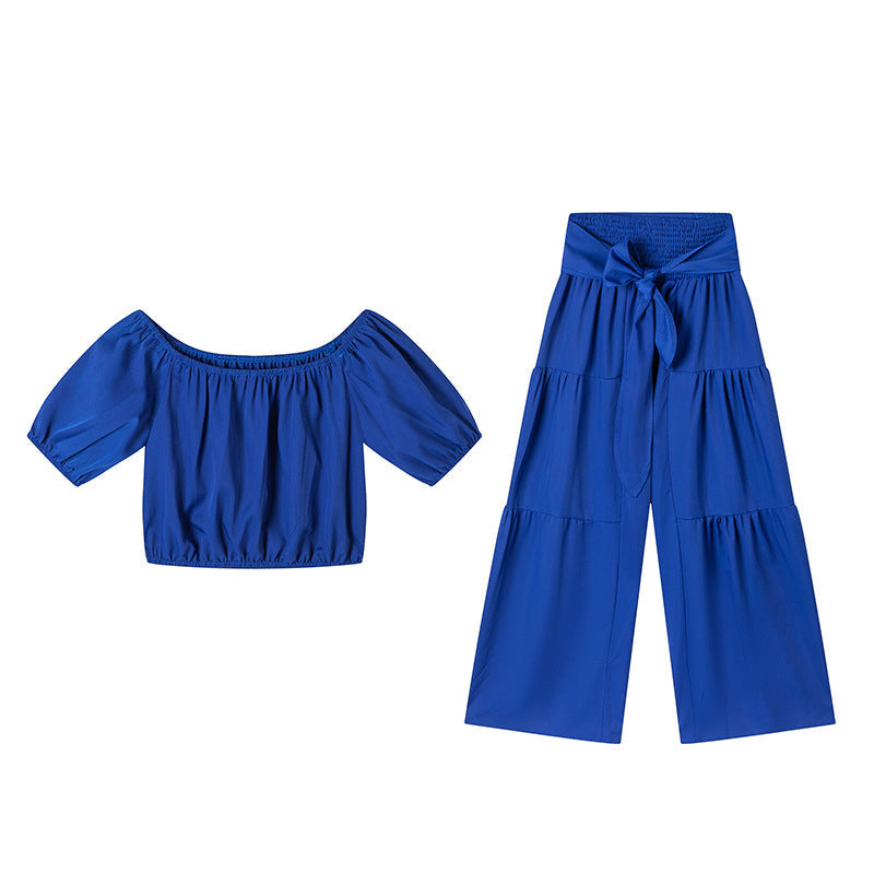 👚 49 % DE RÉDUCTION EN CE MOMENT ! 🌸 Ensemble 2 pièces composé d'un haut à manches bouffantes et épaules dénudées et d'un pantalon à jambes larges – Élégant, confortable et idéal pour les journées d'été ☀️